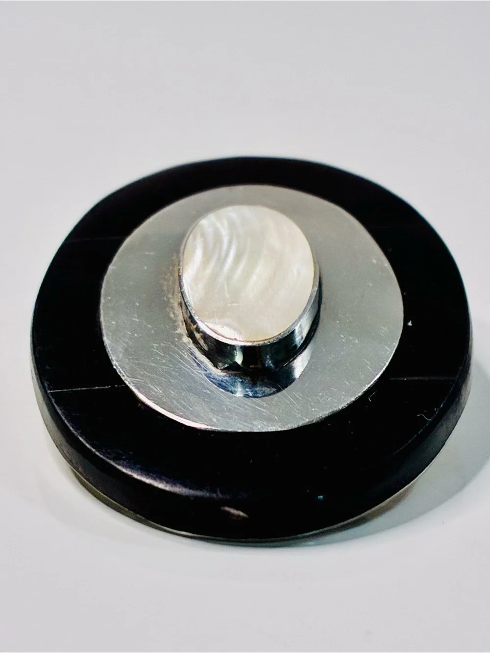 Elevated Simple Black and Silver Oval Brooch with Mother-of-Pearl Center Pendant